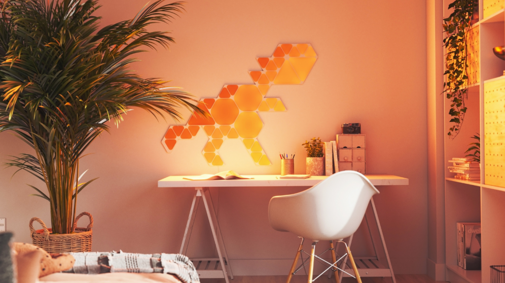 Nanoleaf Shapes Hexagon lighting panels artistically arranged on a living room wall