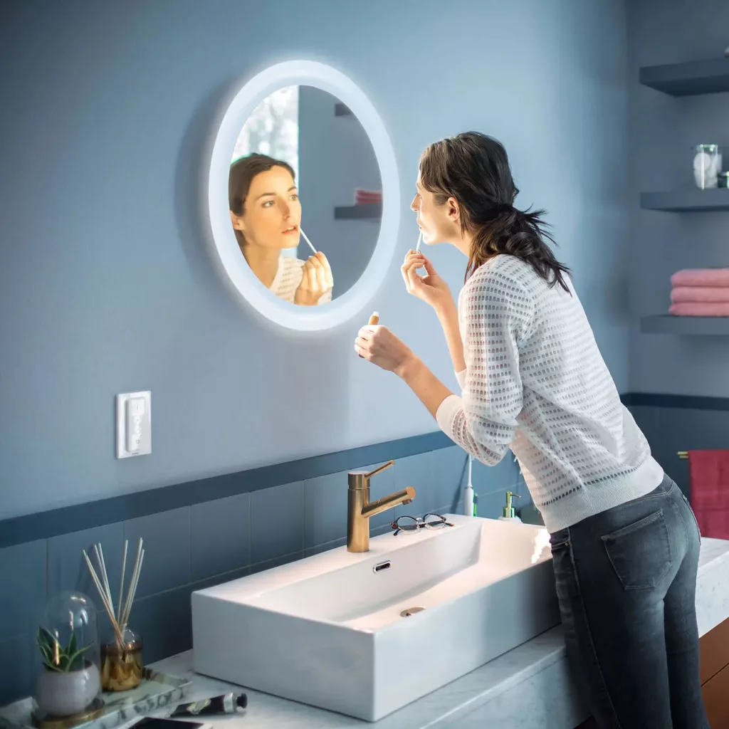 Philips Hue Adore Bathroom Mirror Light (or Ikea's TRADFRI LED Cabinet Light) showcasing smart lighting settings.